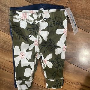 Carter’s pants - 2 pair, 1 - navy blue, 1 - olive green w/flowers, 3 mo, NWT
